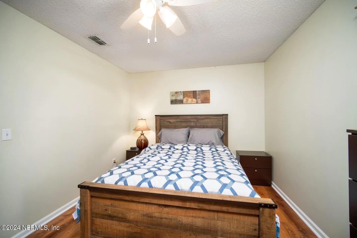 10062 Hawks Hollow Road Jacksonville, FL 32257 - Photo 25 of 39 a bedroom with a bed and a window