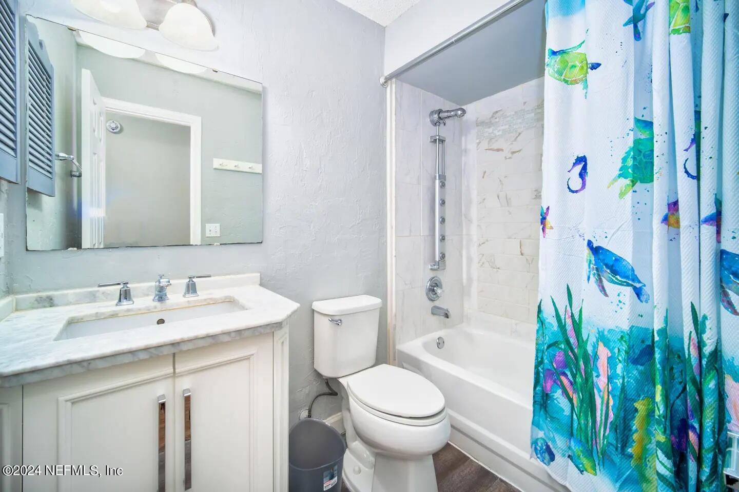 10062 Hawks Hollow Road Jacksonville, FL 32257 - Photo 26 of 39 a bathroom with a sink a toilet and shower