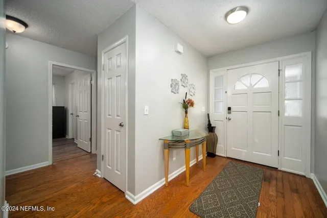 a view of livingroom with hardwood floor and hallway