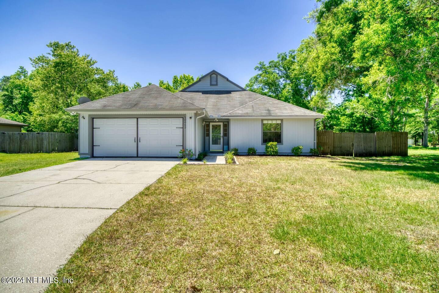 10062 Hawks Hollow Road Jacksonville, FL 32257 - Photo 33 of 39 a front view of house with yard and green space