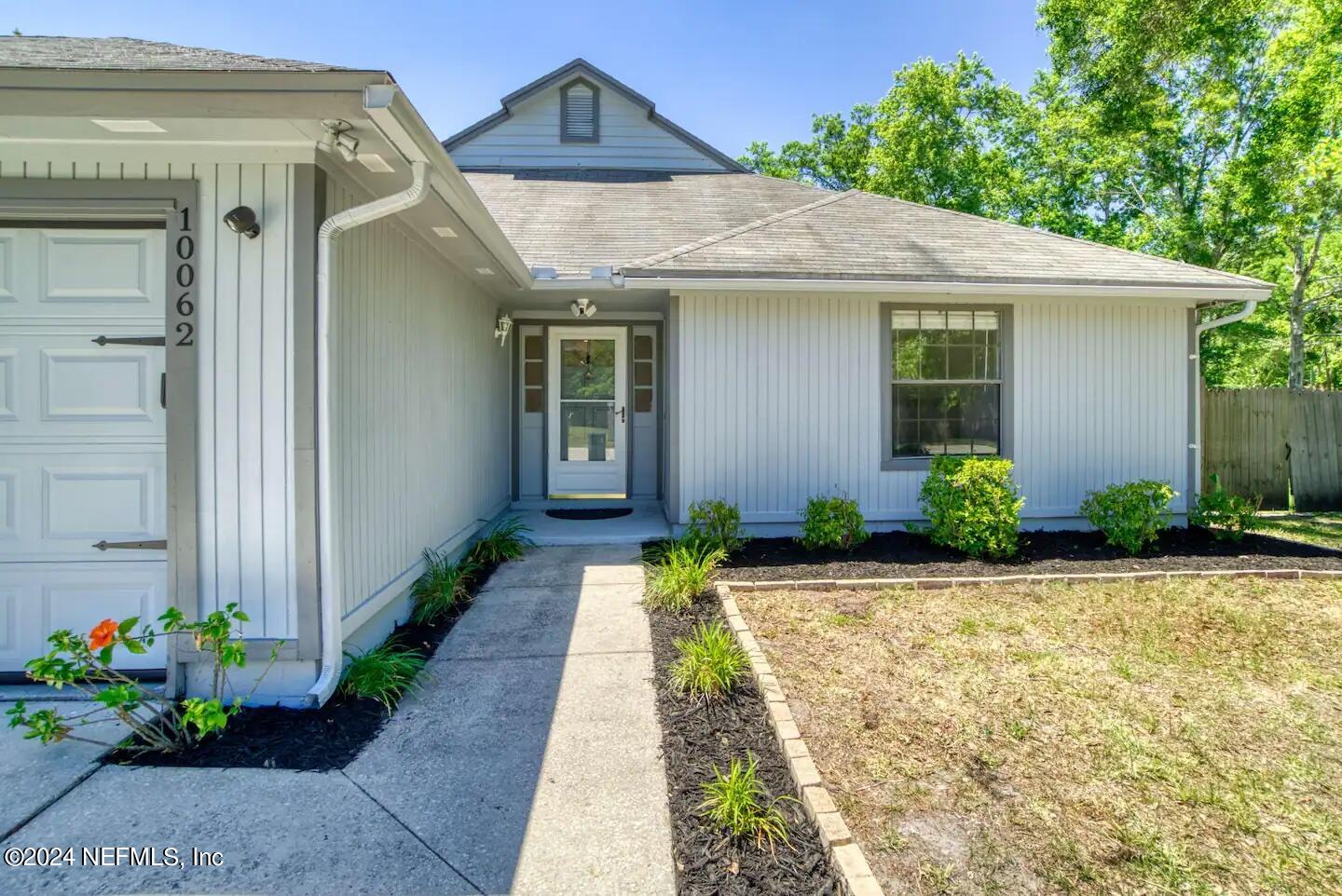 10062 Hawks Hollow Road Jacksonville, FL 32257 - Photo 36 of 39 a front view of a house with a yard