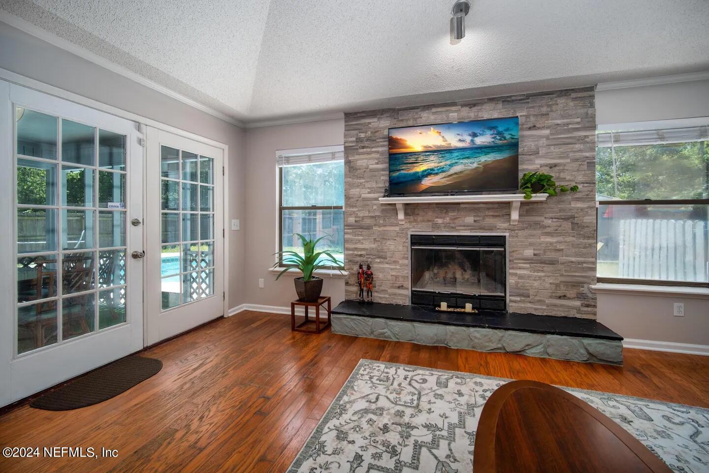 10062 Hawks Hollow Road Jacksonville, FL 32257 - Photo 4 of 39 a living room with furniture and a fireplace