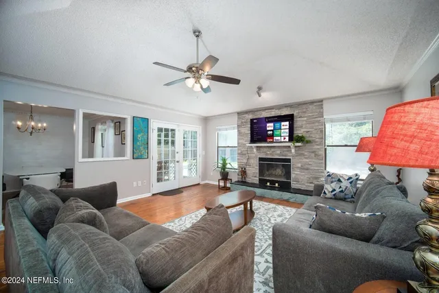a living room with furniture and a fireplace