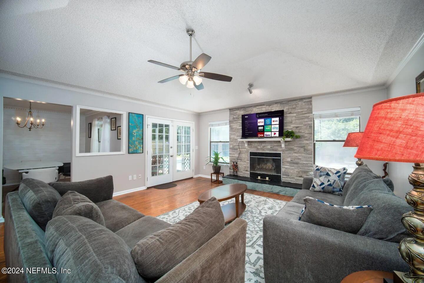 10062 Hawks Hollow Road Jacksonville, FL 32257 - Photo 8 of 39 a living room with furniture and a fireplace