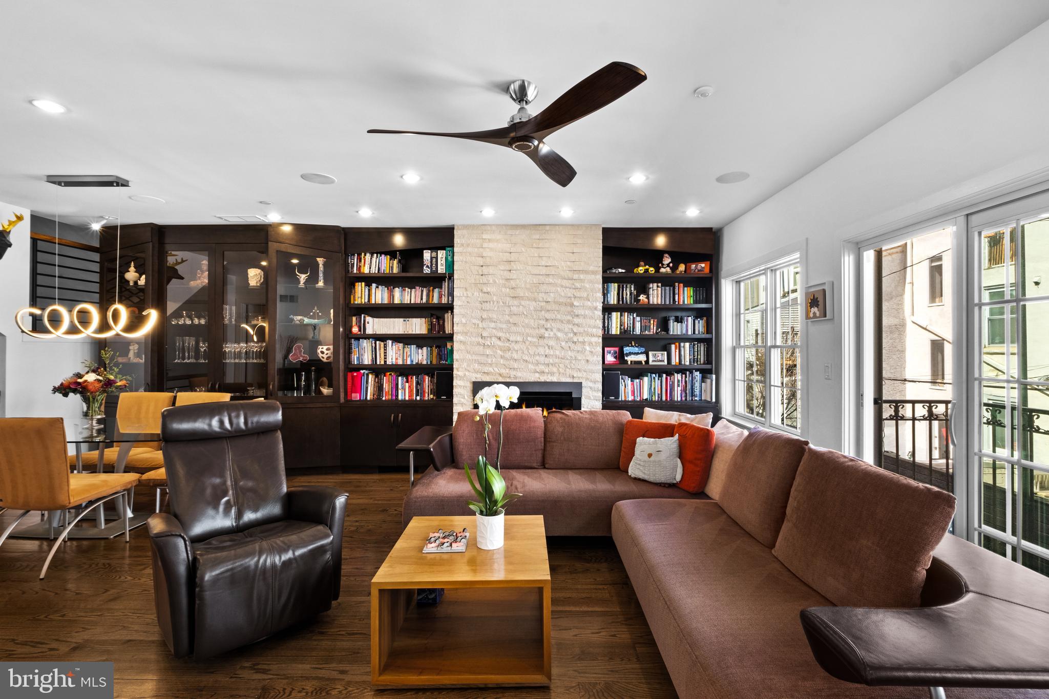 1815 Lombard Street Philadelphia, PA 19146 - Photo 16 of 79 a living room with fireplace furniture and a large window
