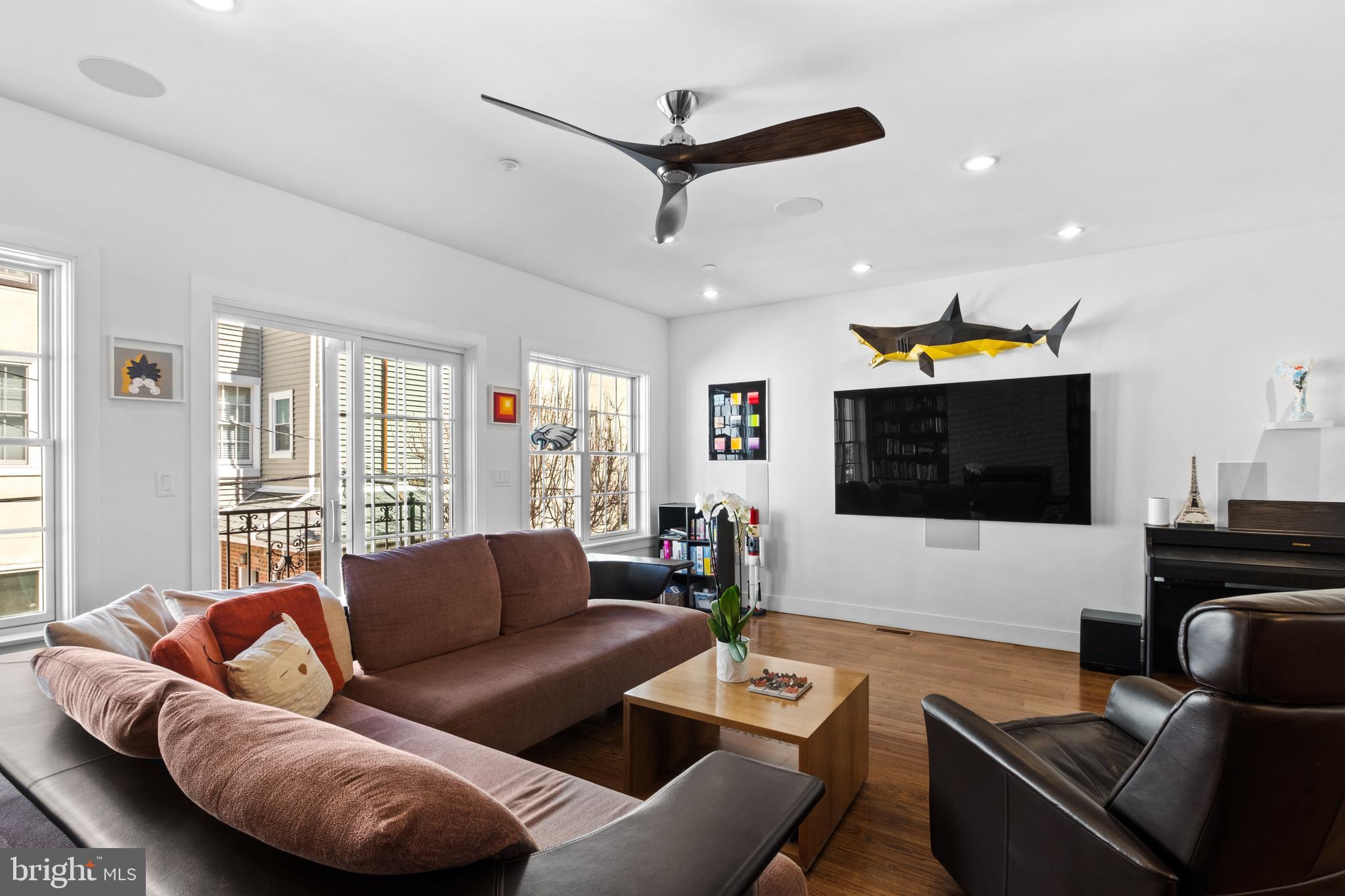 1815 Lombard Street Philadelphia, PA 19146 - Photo 18 of 79 a living room with furniture and a flat screen tv