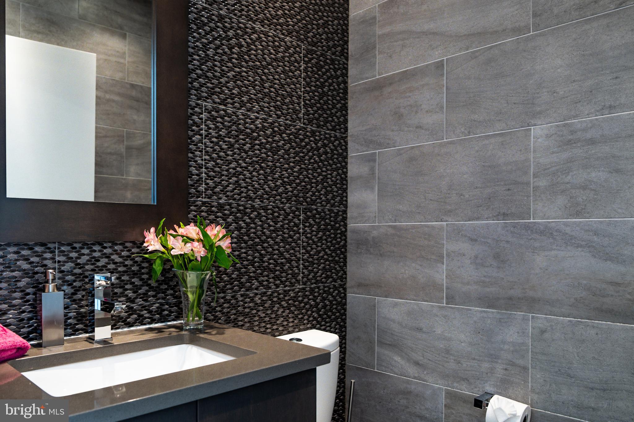 1815 Lombard Street Philadelphia, PA 19146 - Photo 22 of 79 a room with a sink and a mirror