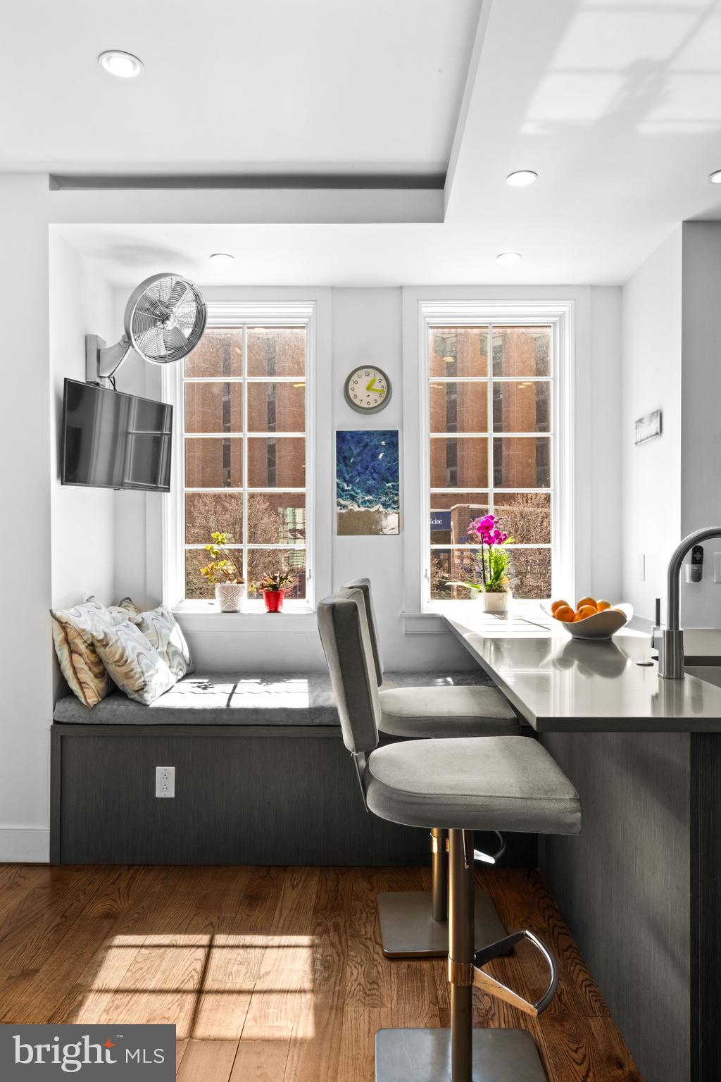 1815 Lombard Street Philadelphia, PA 19146 - Photo 24 of 79 a living room with granite countertop furniture a dining table and chairs