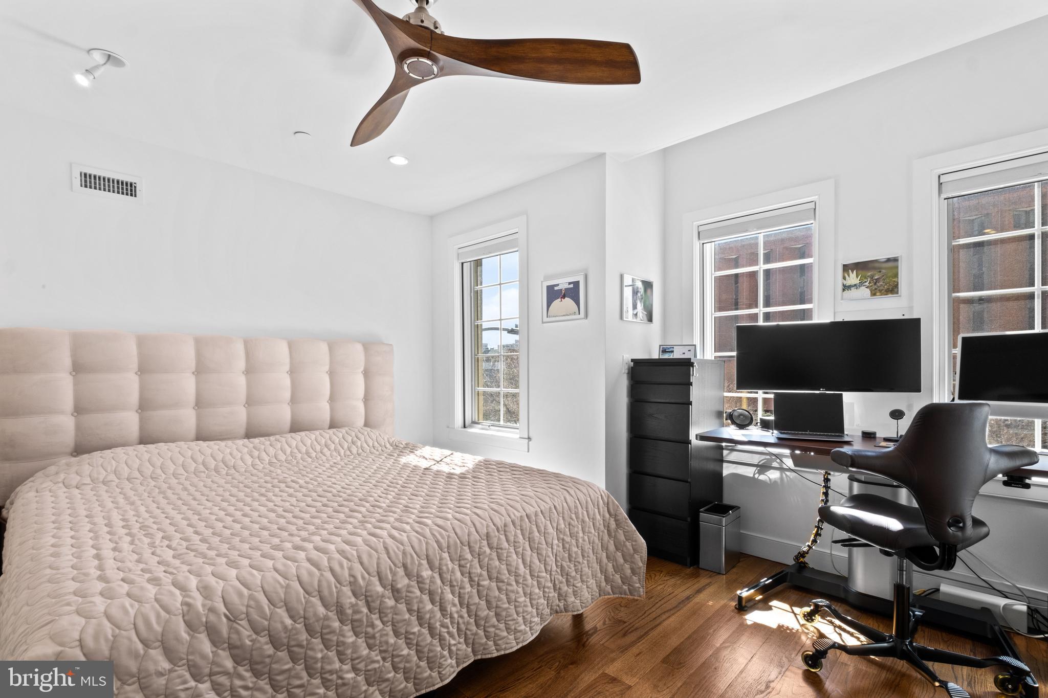 1815 Lombard Street Philadelphia, PA 19146 - Photo 39 of 79 a bedroom with a bed and a desk