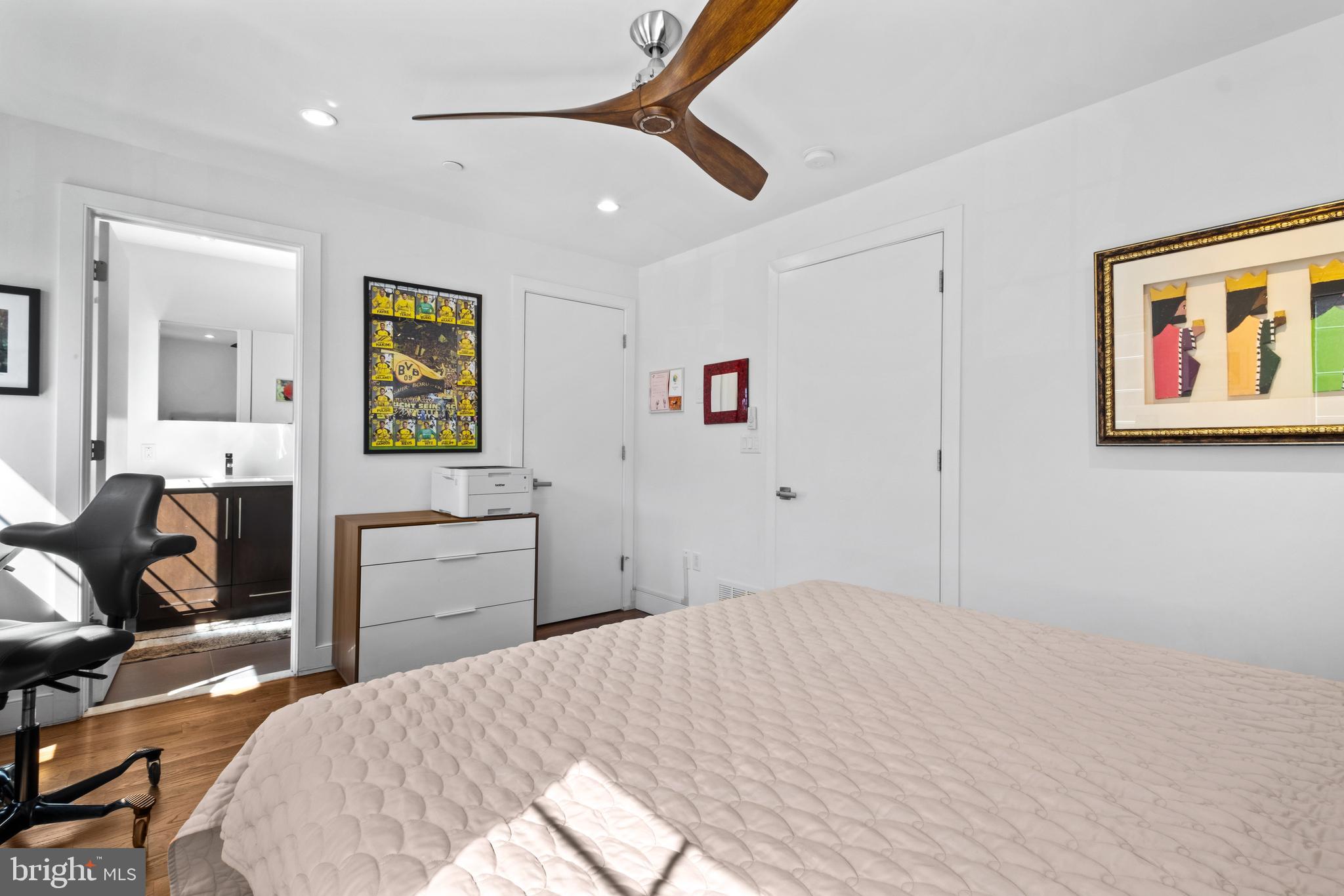 1815 Lombard Street Philadelphia, PA 19146 - Photo 40 of 79 a bedroom with a bed and wooden floor