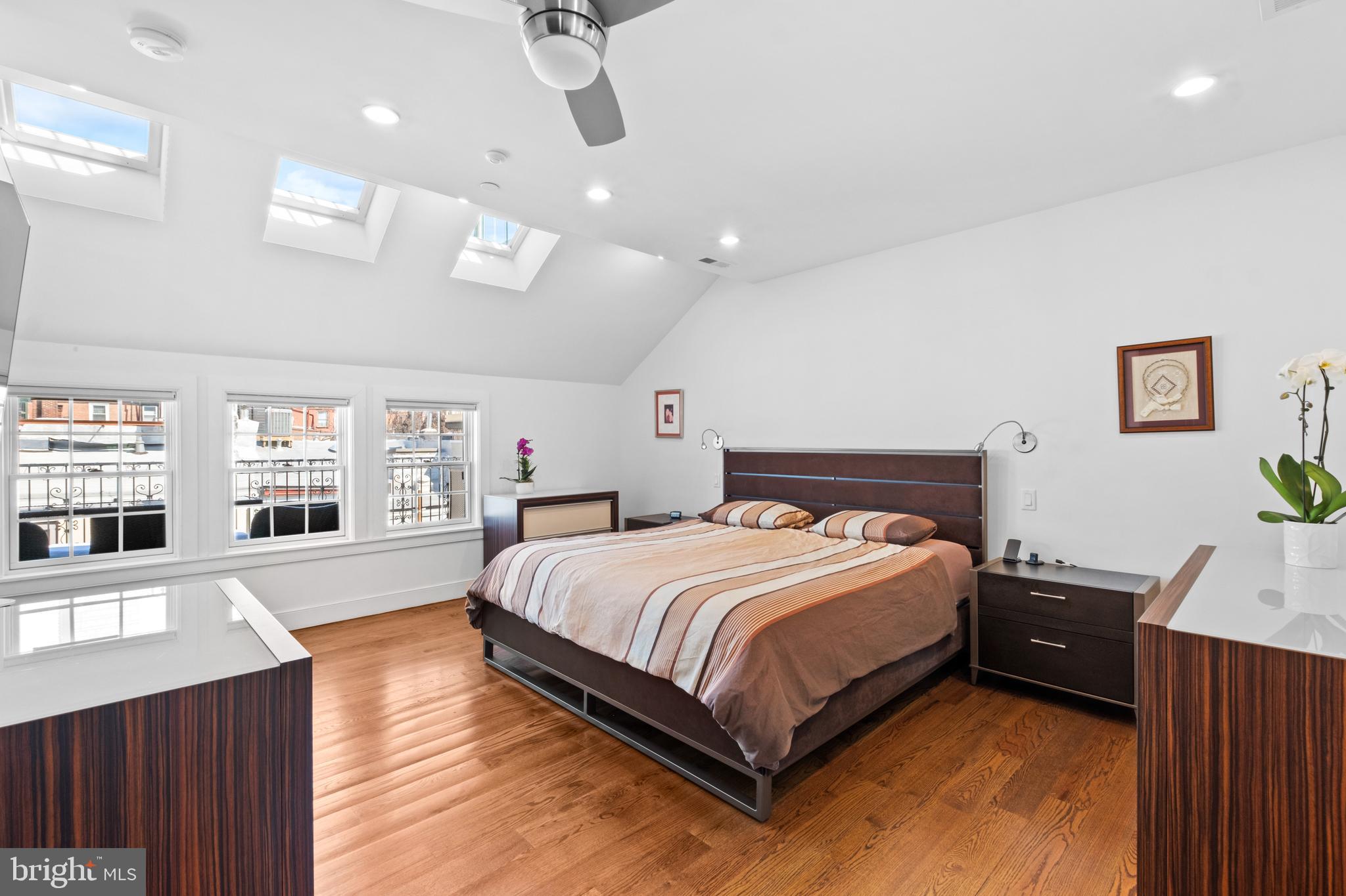 1815 Lombard Street Philadelphia, PA 19146 - Photo 43 of 79 a bedroom with a large bed and a wooden floor