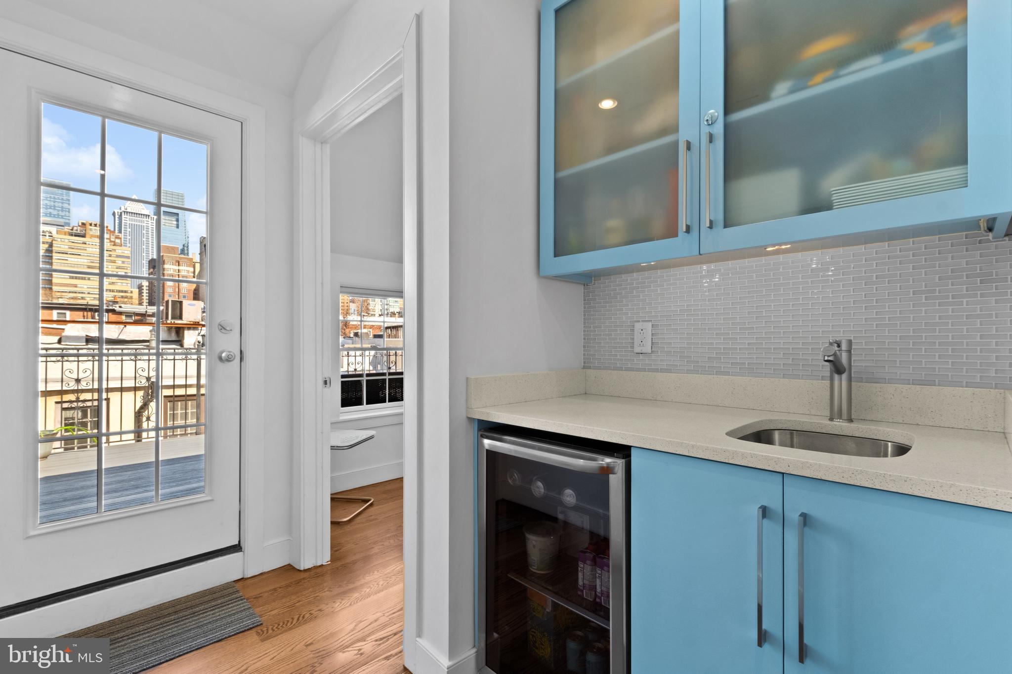 1815 Lombard Street Philadelphia, PA 19146 - Photo 52 of 79 a kitchen with a sink and cabinets