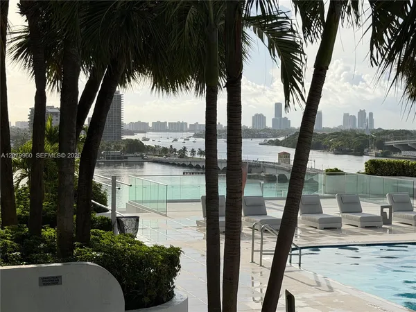 a view of backyard with swimming pool and outdoor seating