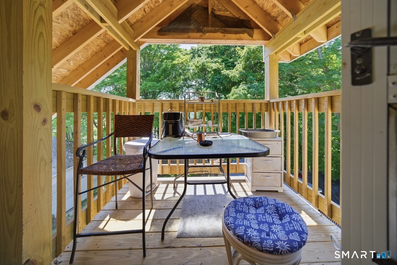 12 Webster Street Vernon, CT 06066 - Photo 30 of 33 a view of balcony with table and chairs