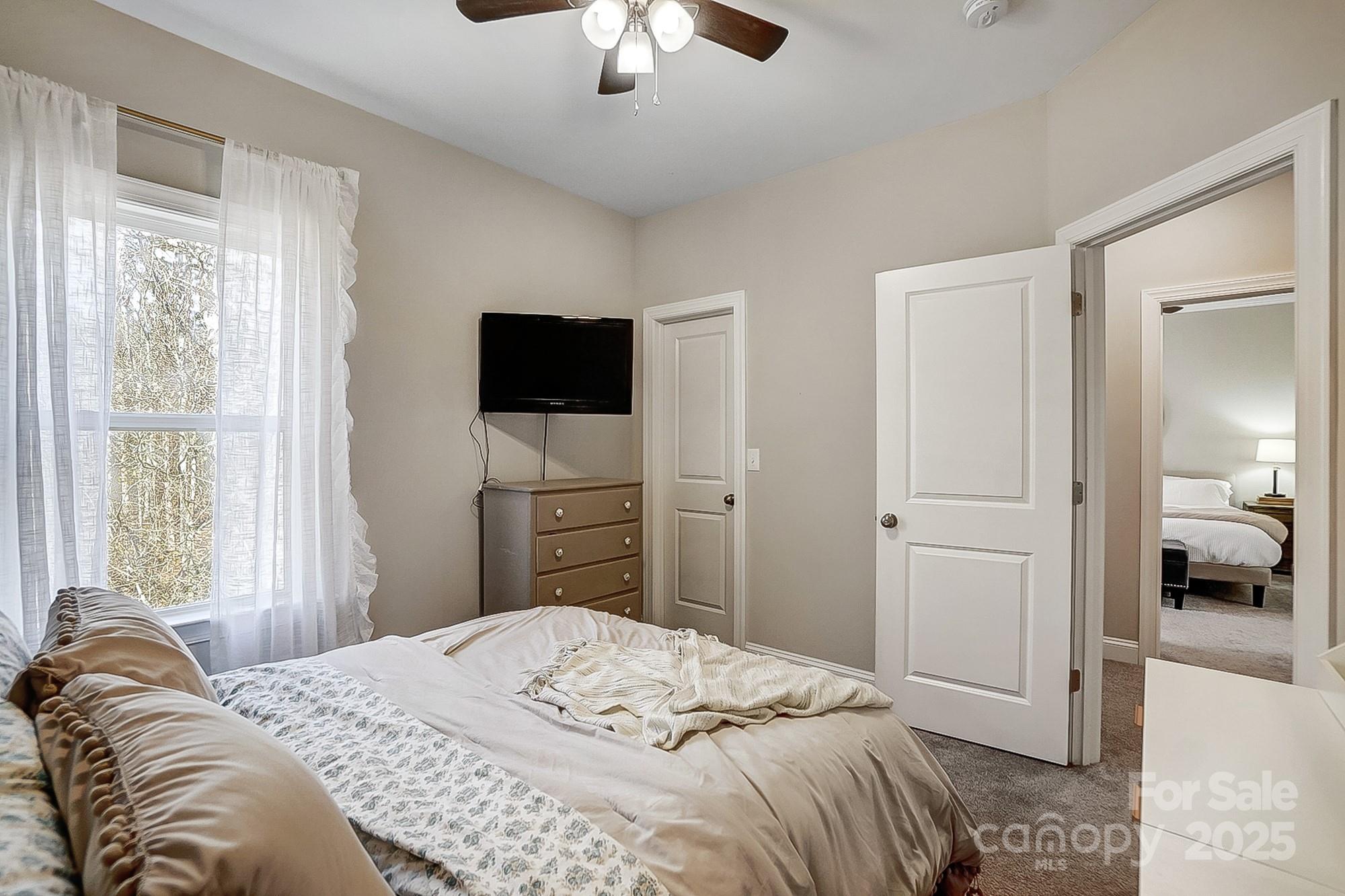 356 Nantucket Way Rock Hill, SC 29732 - Photo 23 of 34 a bedroom with a bed and a flat tv screen