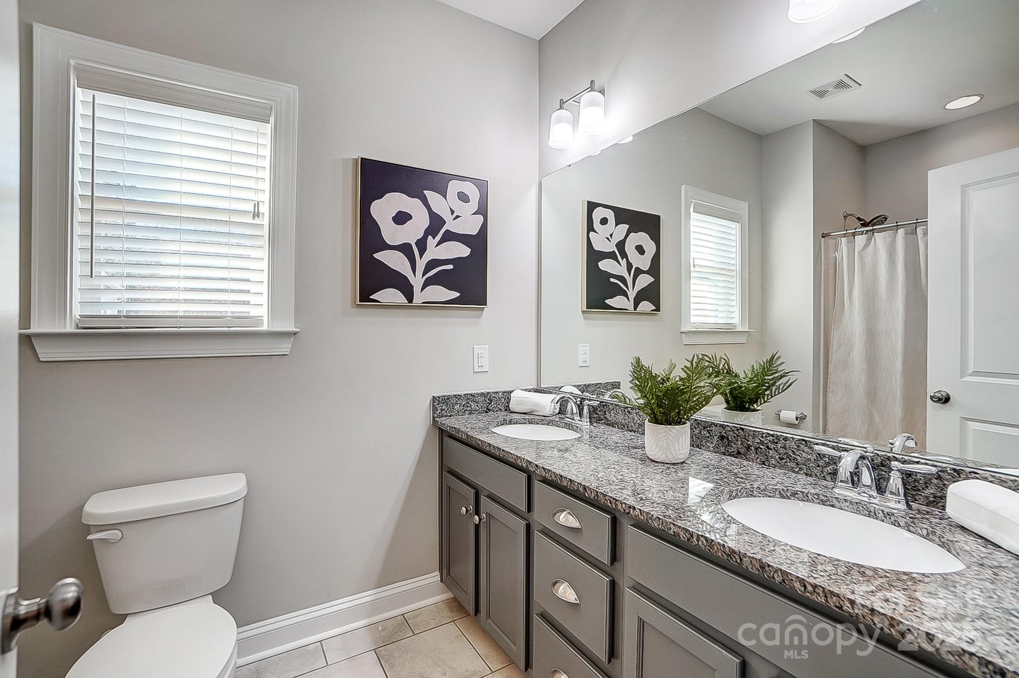 356 Nantucket Way Rock Hill, SC 29732 - Photo 27 of 34 a bathroom with a granite countertop sink mirror vanity and toilet
