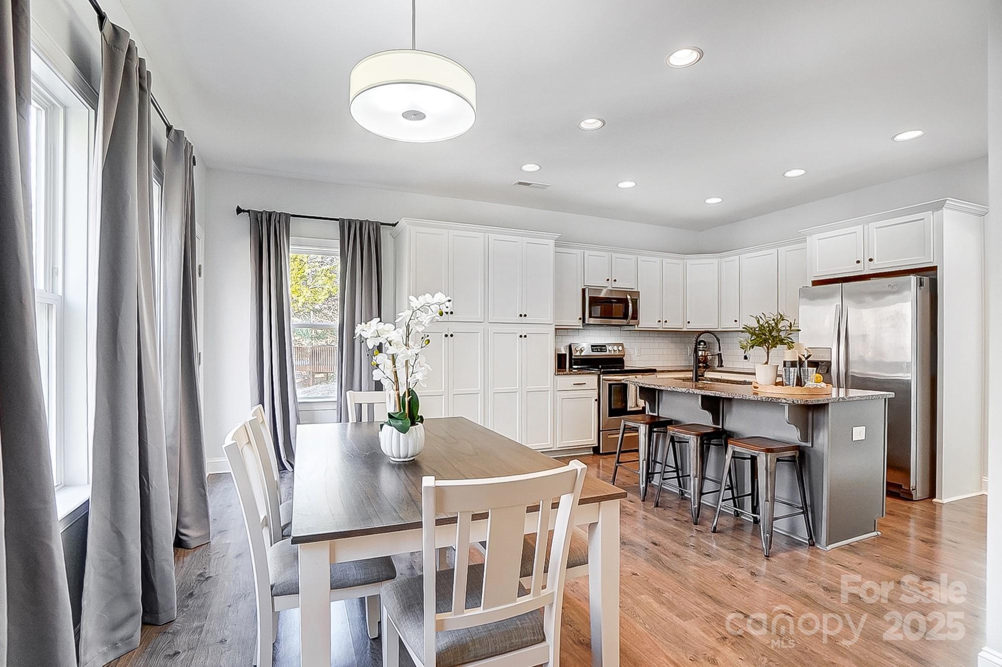 356 Nantucket Way Rock Hill, SC 29732 - Photo 5 of 34 a view of kitchen with dining table and chairs