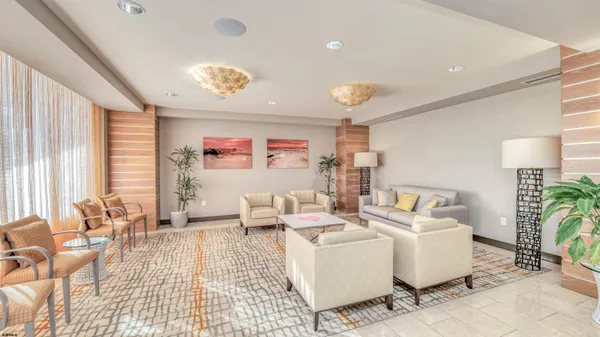 a living room with furniture and a table