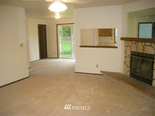 10801 Southeast 170th Street Renton, WA 98055 - Photo 4 of 10 a view of a livingroom with a fireplace