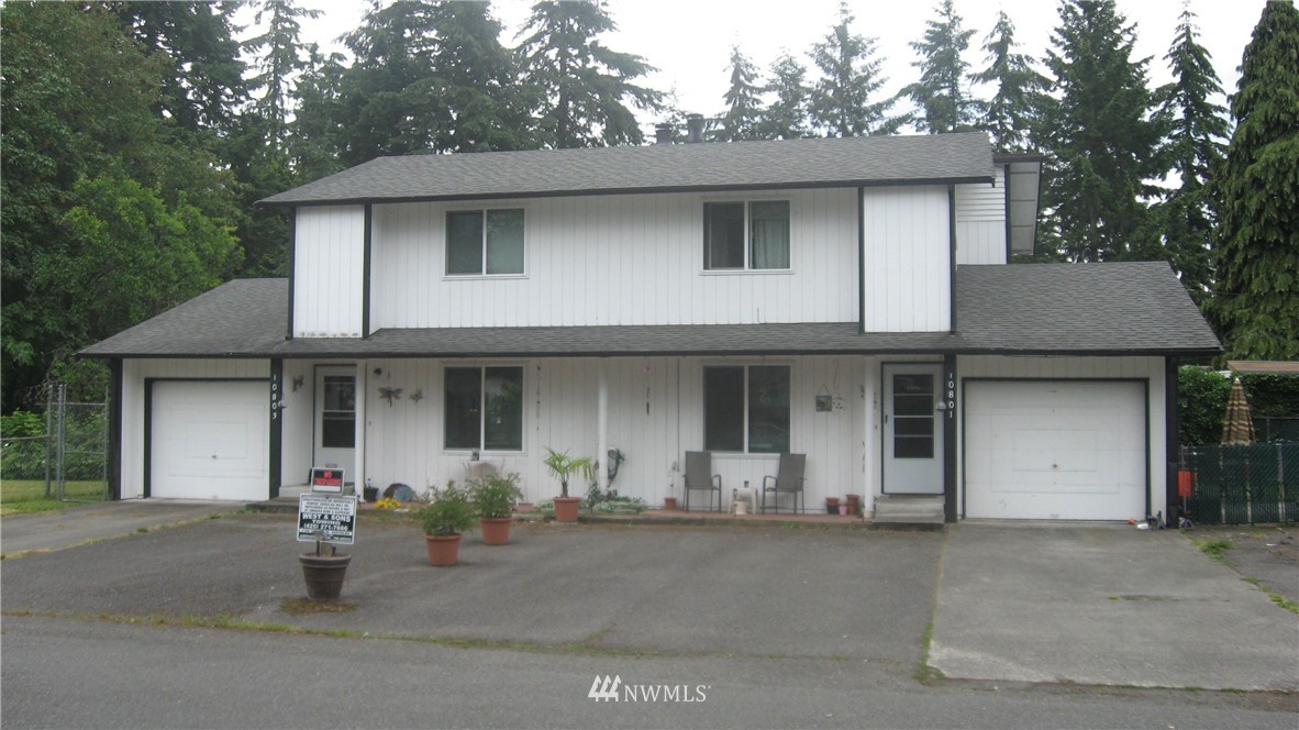 10801 Southeast 170th Street Renton, WA 98055 - Photo 10 of 10 a front view of a house with a yard and garage
