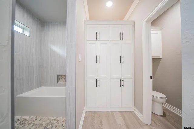 a bathroom with a shower and a toilet