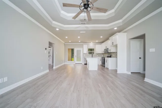 a view of kitchen with cabinets and wooden floor
