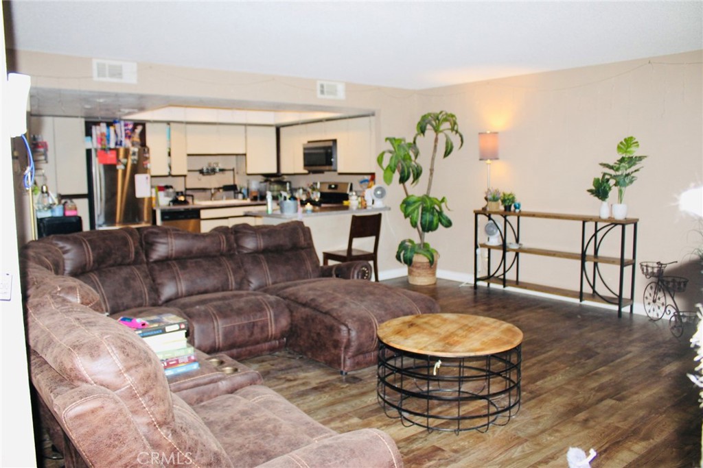 25584 Sharp Drive, Unit D Hemet, CA 92544 - Photo 3 of 9 a living room with furniture and wooden floor