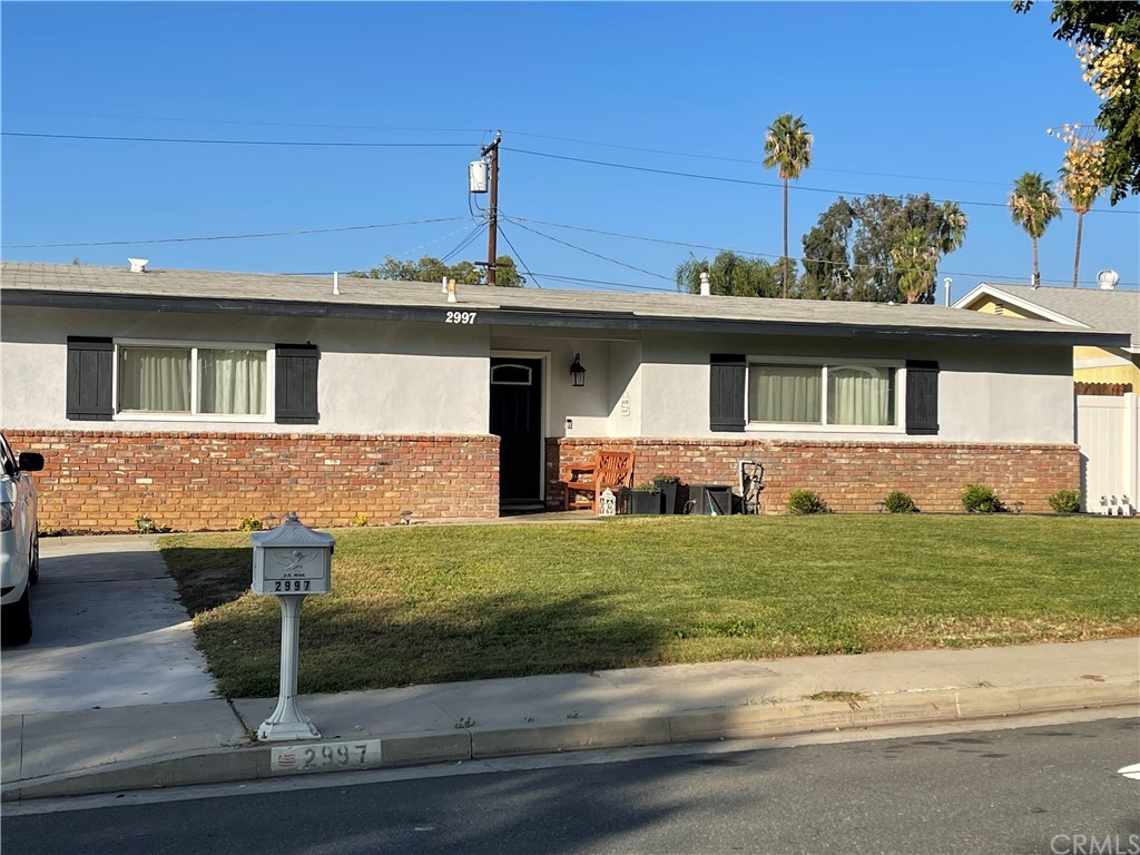 2997 Cimarron Road Riverside, CA 92506 - Photo 1 of 1 a front view of a house with garden