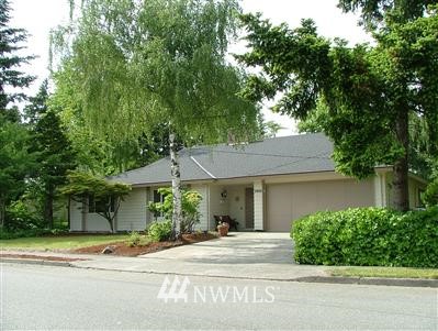3908 Northeast 11th Street Renton, WA 98056 - Photo 1 of 1 a house with a tree in front of it