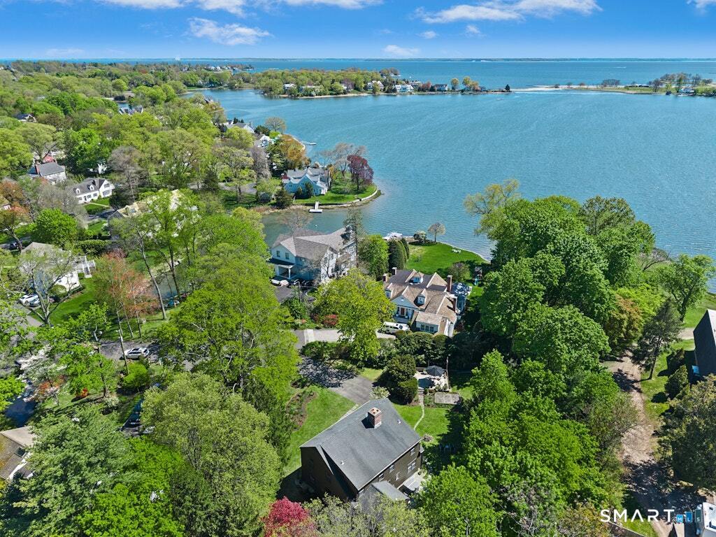 8 Seagate Road Darien, CT 06820 - Photo 1 of 33 an aerial view of a house with a lake view