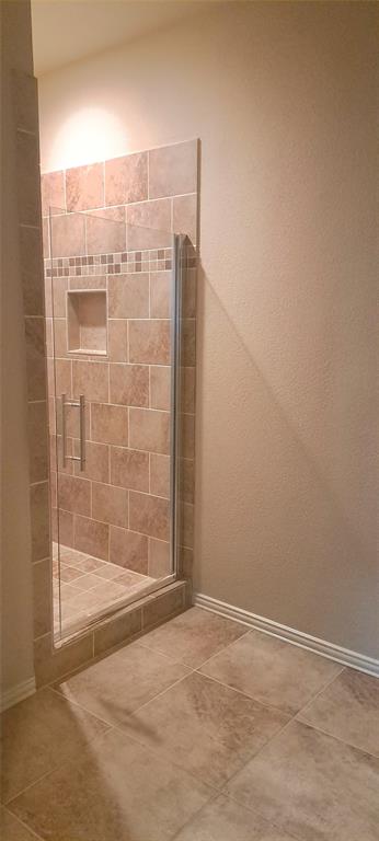 1301 Old Dicey Road, Unit 443 Weatherford, TX 76085 - Photo 5 of 11 a bathroom with a shower