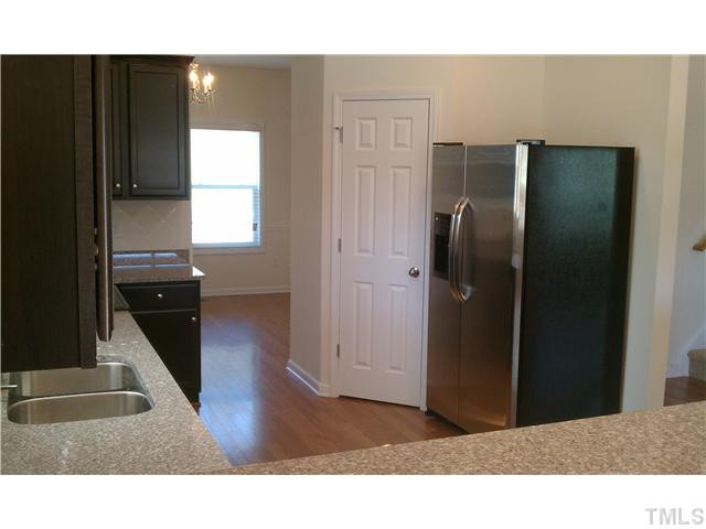 1507 Pattersons Mill Road Durham, NC 27703 - Photo 4 of 25 Beautiful granite and expresso cabinets compliment this kitchen!