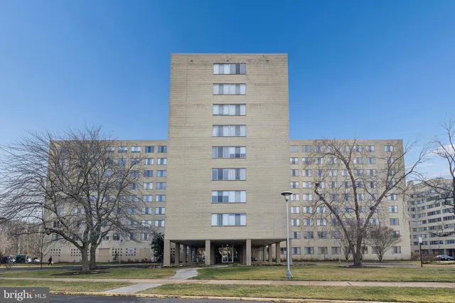 a view of a building with trees in the background