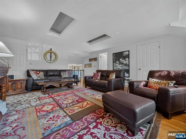 a living room with furniture and a rug