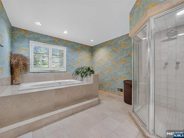 a bedroom with furniture and a wooden floor