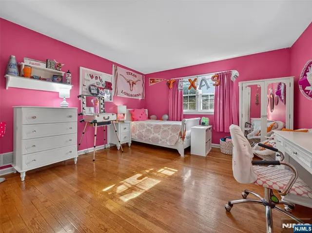 a living room with furniture and a book shelf
