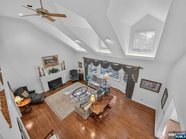 a bedroom with bed and wooden floor