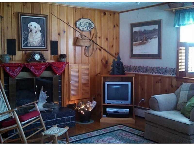 4 Pinkham Street Lincoln, ME 04457 - Photo 9 of 30 Living Room. Nothing like a cozy...