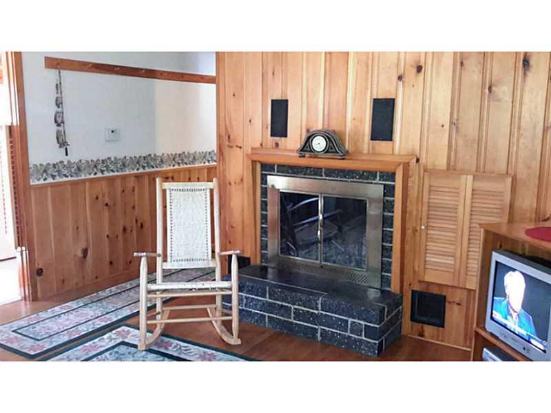 4 Pinkham Street Lincoln, ME 04457 - Photo 10 of 30 Living Room. Warm evenings spent by...