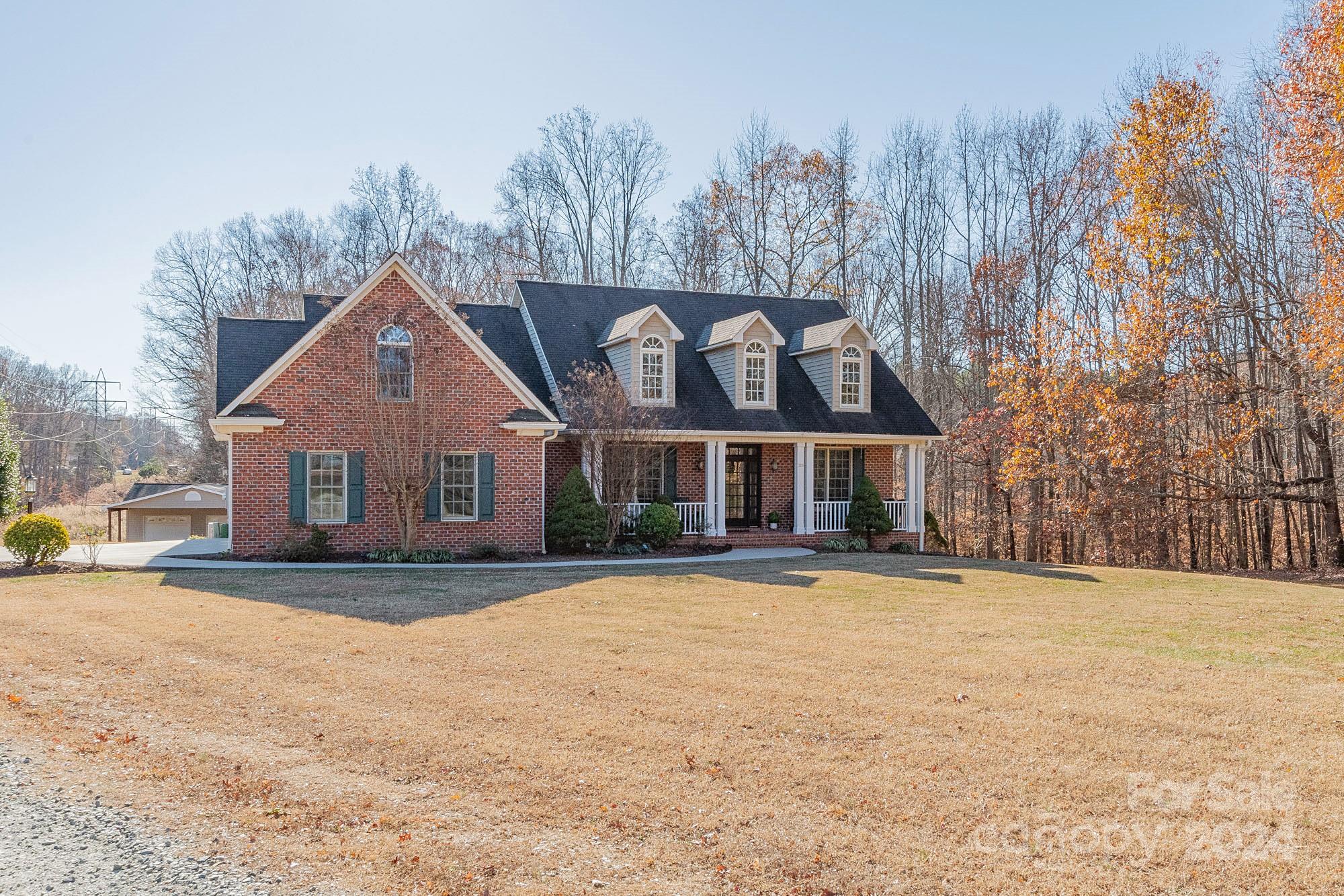 3211 Happy Hill Road Lexington, NC 27295 - Photo 1 of 44 a front view of a house with a yard
