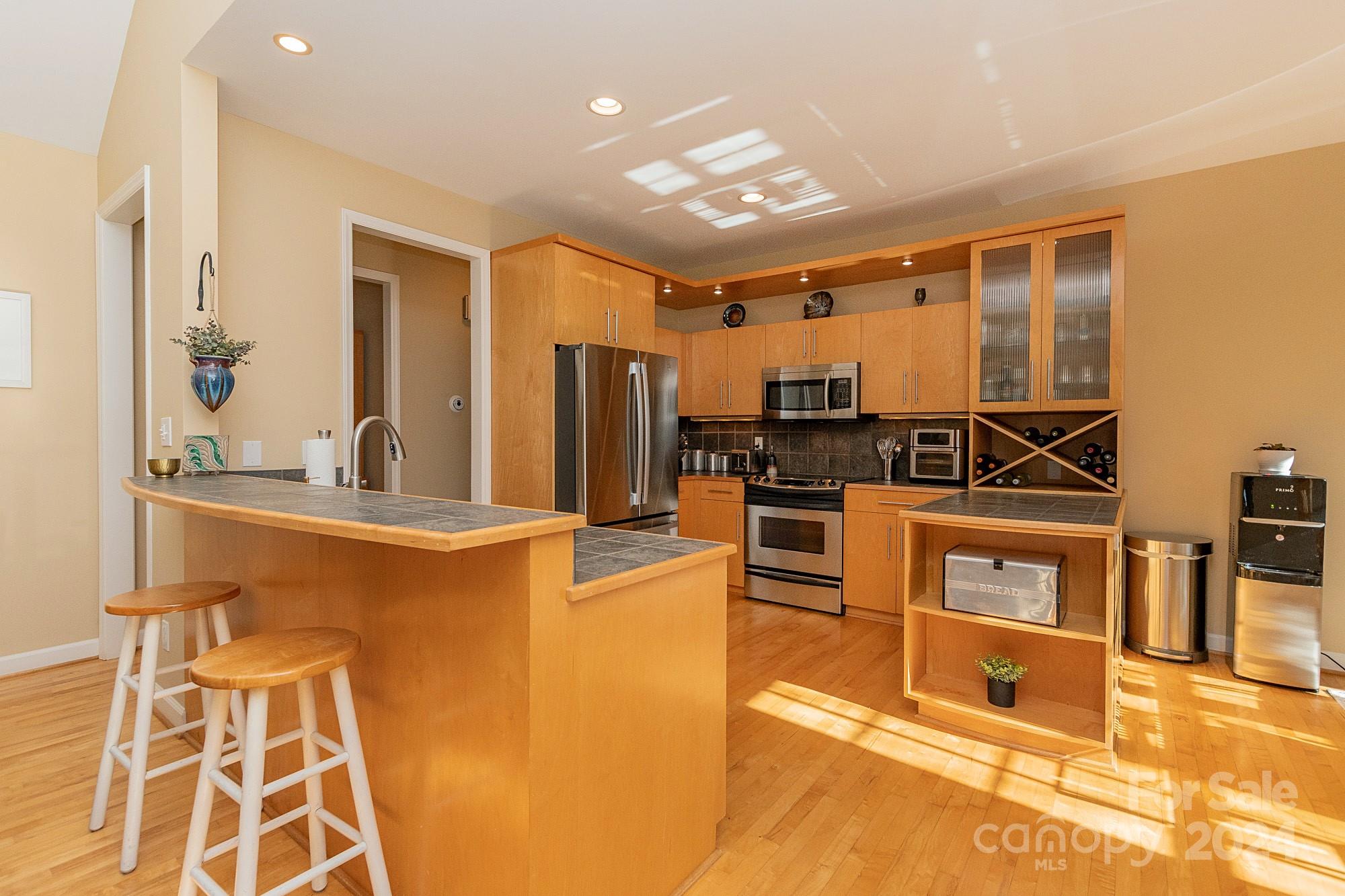 3211 Happy Hill Road Lexington, NC 27295 - Photo 14 of 44 a view of kitchen with kitchen island stainless steel appliances refrigerator stove microwave and cabinets