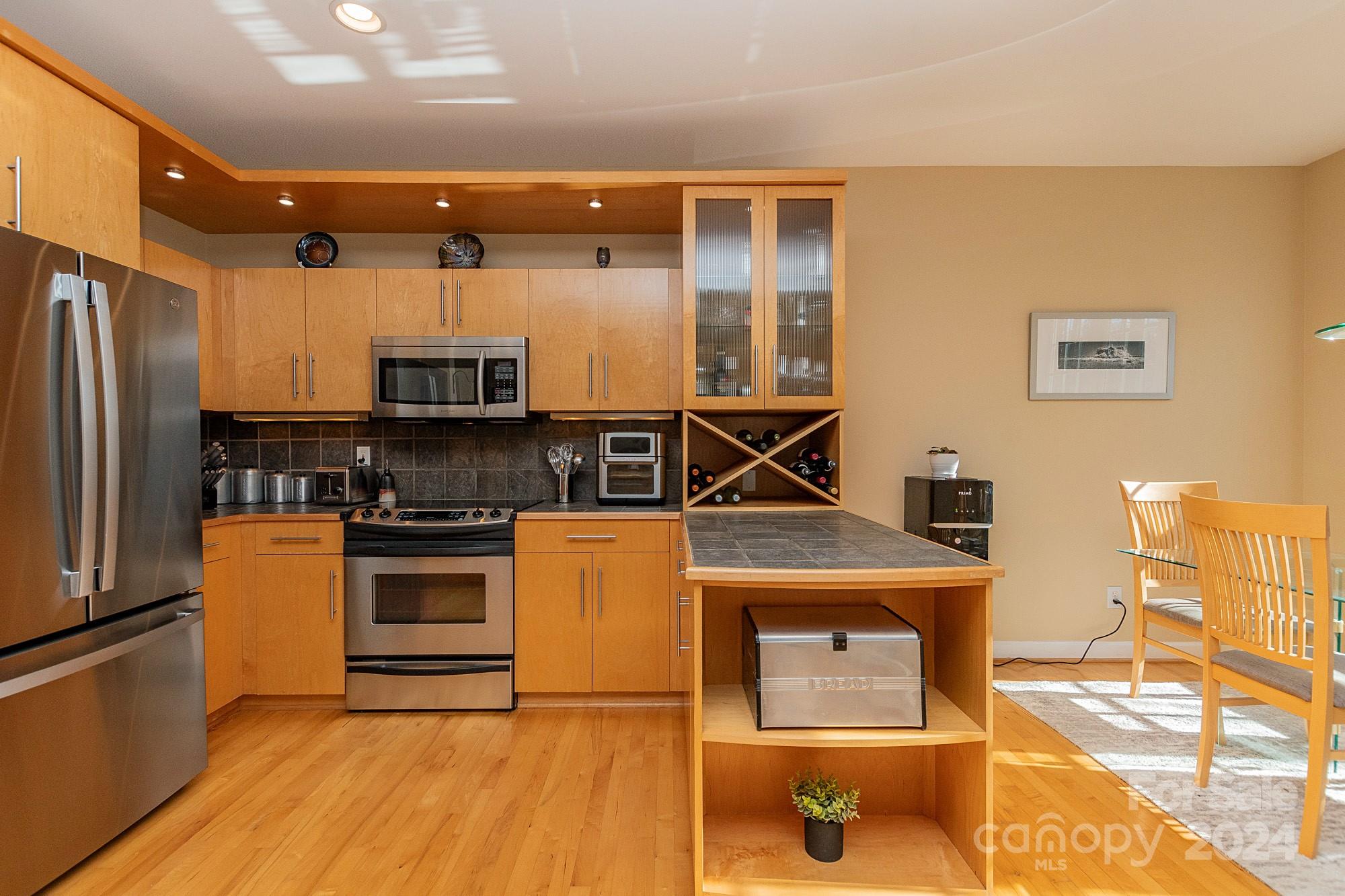 3211 Happy Hill Road Lexington, NC 27295 - Photo 15 of 44 a kitchen with stainless steel appliances a stove a refrigerator and a refrigerator