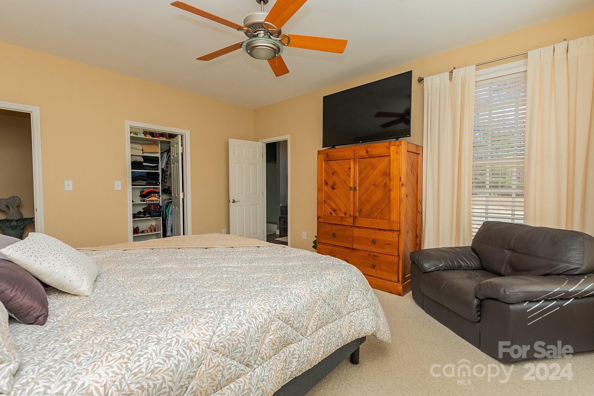 3211 Happy Hill Road Lexington, NC 27295 - Photo 23 of 44 a bedroom with a large bed and a flat screen tv