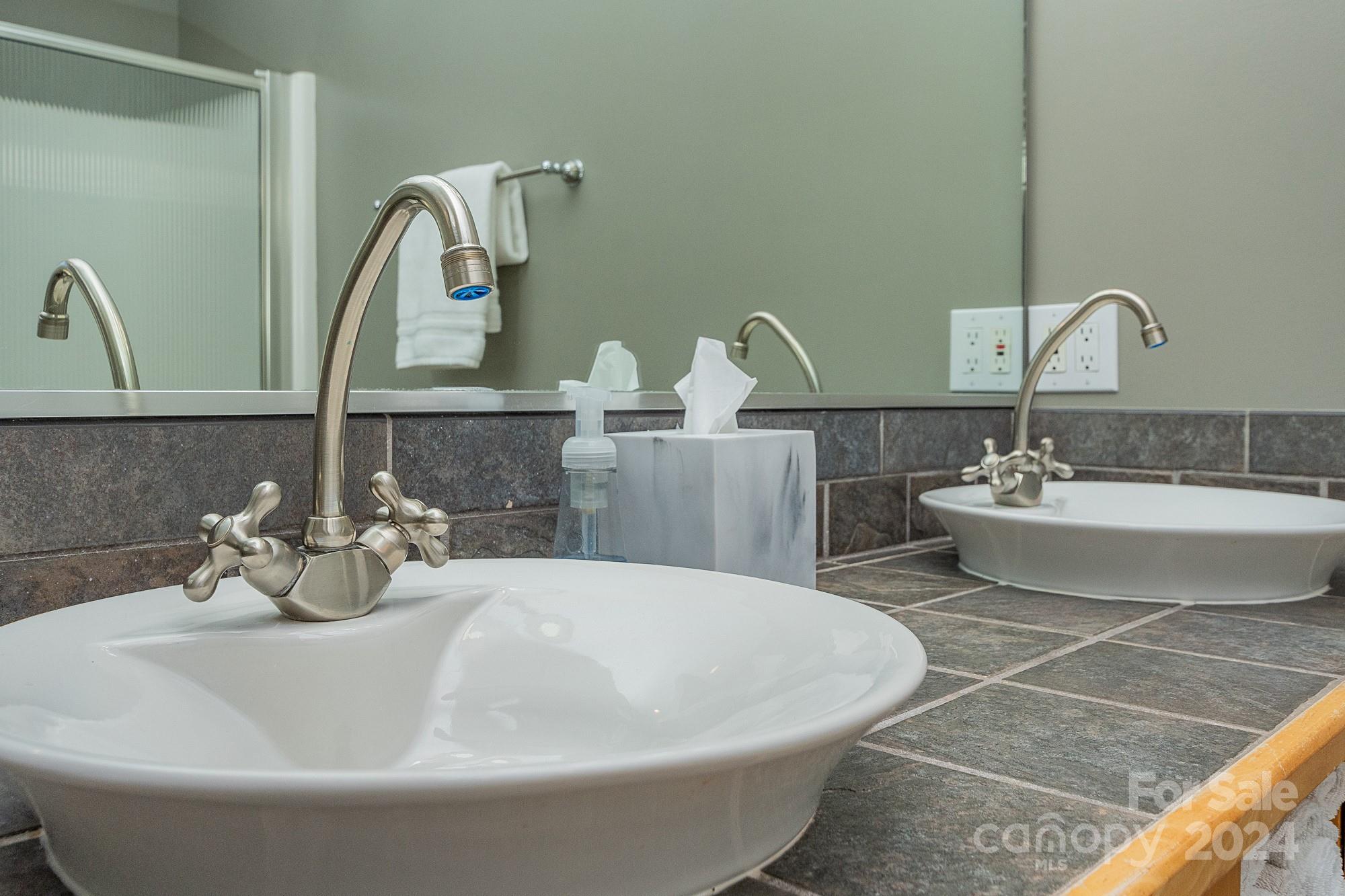 3211 Happy Hill Road Lexington, NC 27295 - Photo 26 of 44 a bathroom with a sink and a mirror