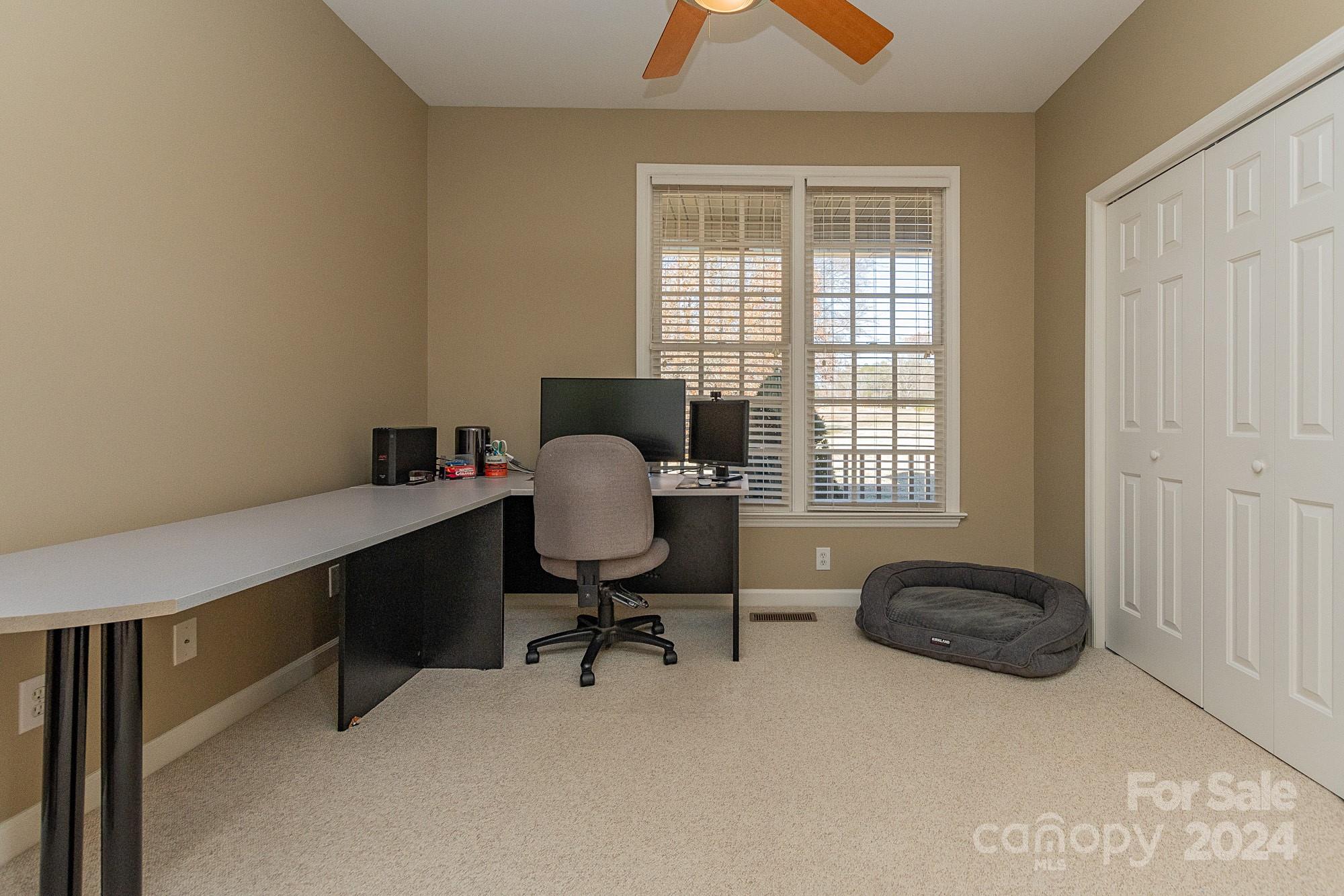 3211 Happy Hill Road Lexington, NC 27295 - Photo 27 of 44 a view of a workspace with furniture and a window
