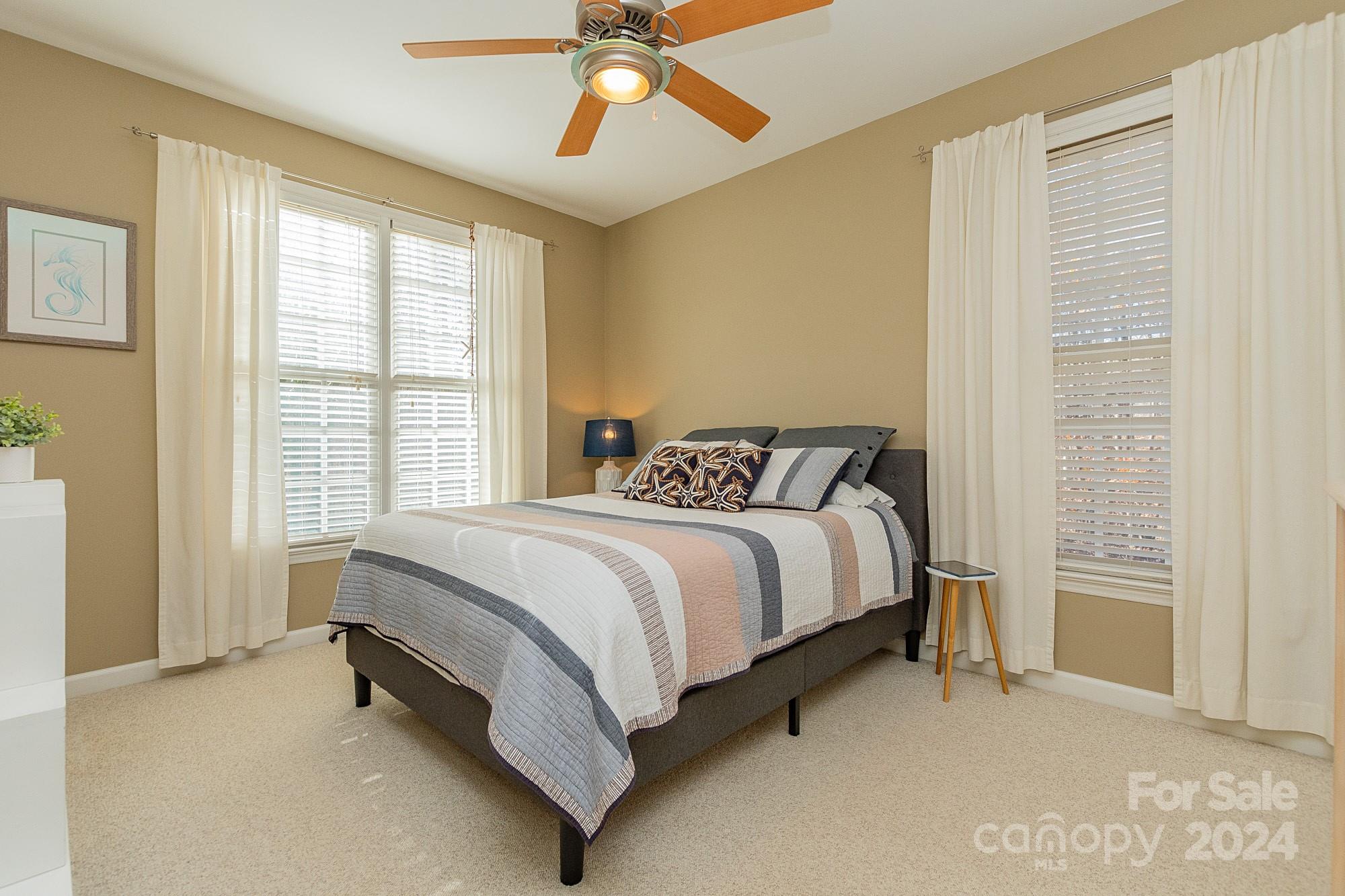 3211 Happy Hill Road Lexington, NC 27295 - Photo 29 of 44 a bed sitting in a bedroom next to a window