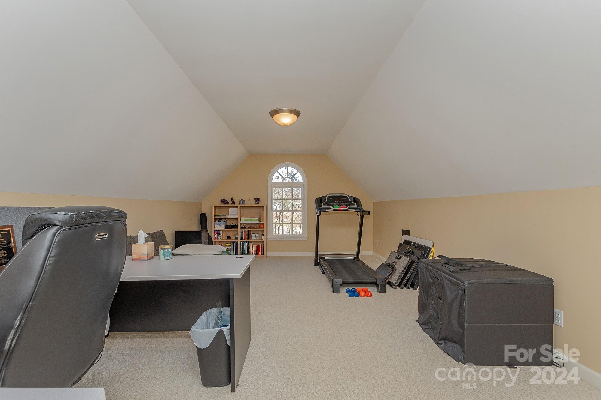 3211 Happy Hill Road Lexington, NC 27295 - Photo 32 of 44 a room with a couch and a chandelier