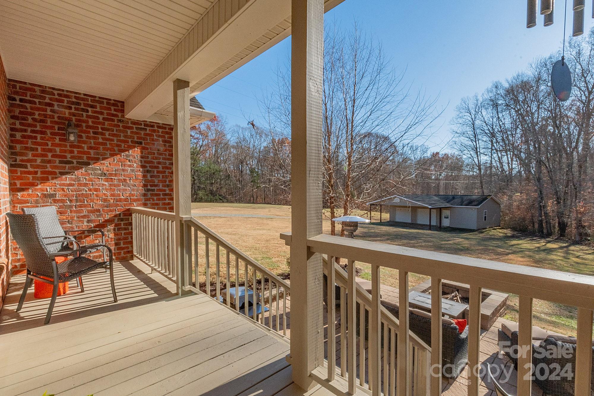 3211 Happy Hill Road Lexington, NC 27295 - Photo 36 of 44 a view of a balcony with wooden floor and bench