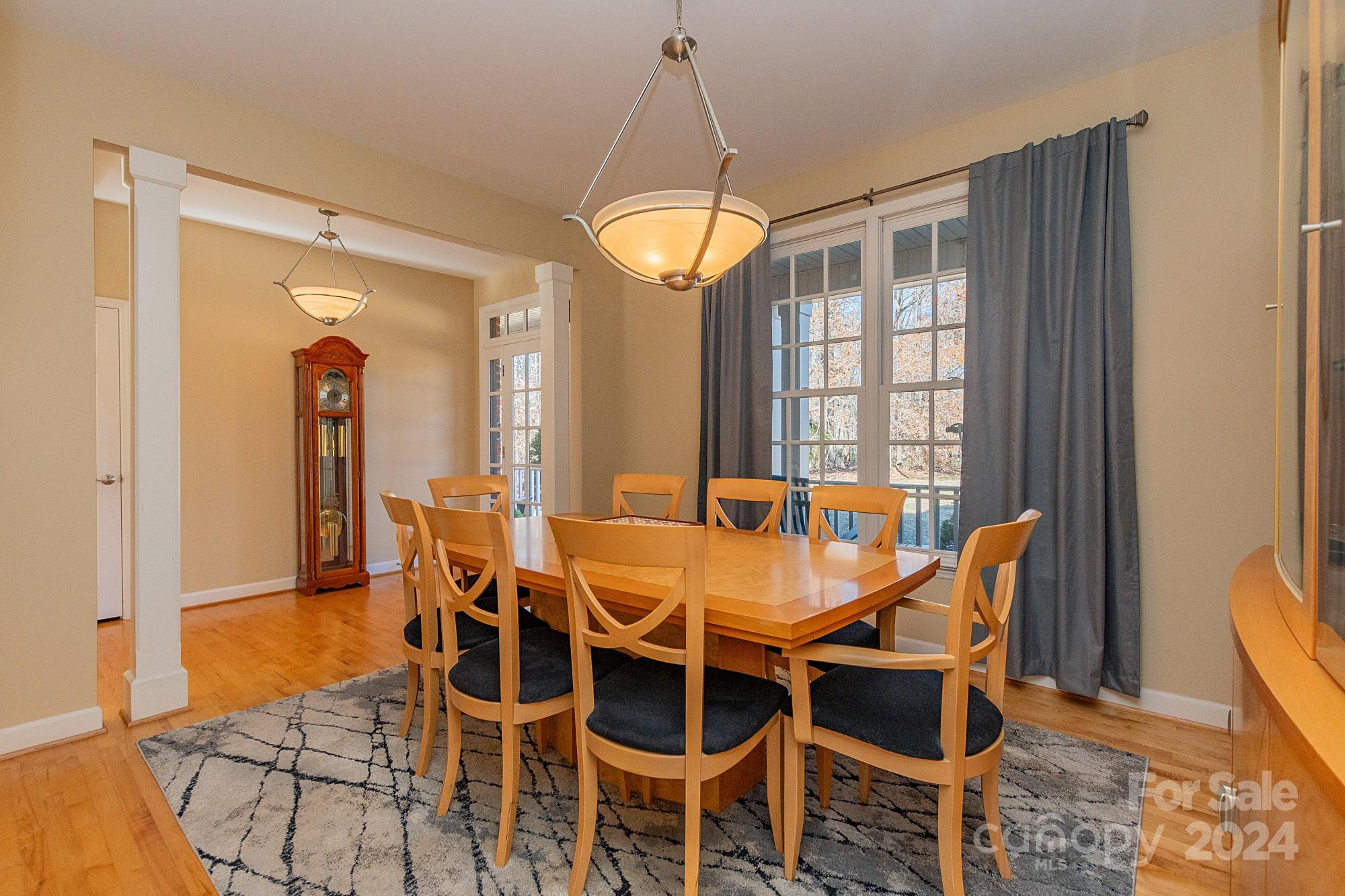 3211 Happy Hill Road Lexington, NC 27295 - Photo 10 of 44 a dining room with furniture a chandelier and wooden floor