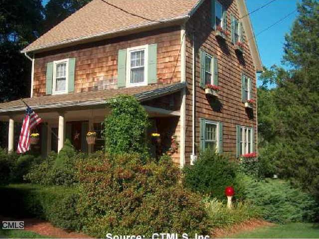1141 Racebrook Road Woodbridge, CT 06525 - Photo 1 of 1 a front view of house with a yard